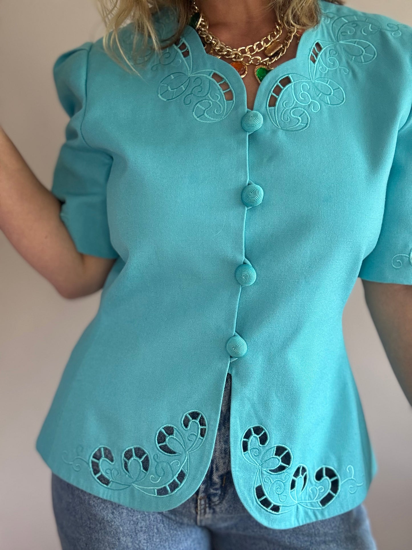 Vintage teal jacket with cut-out details