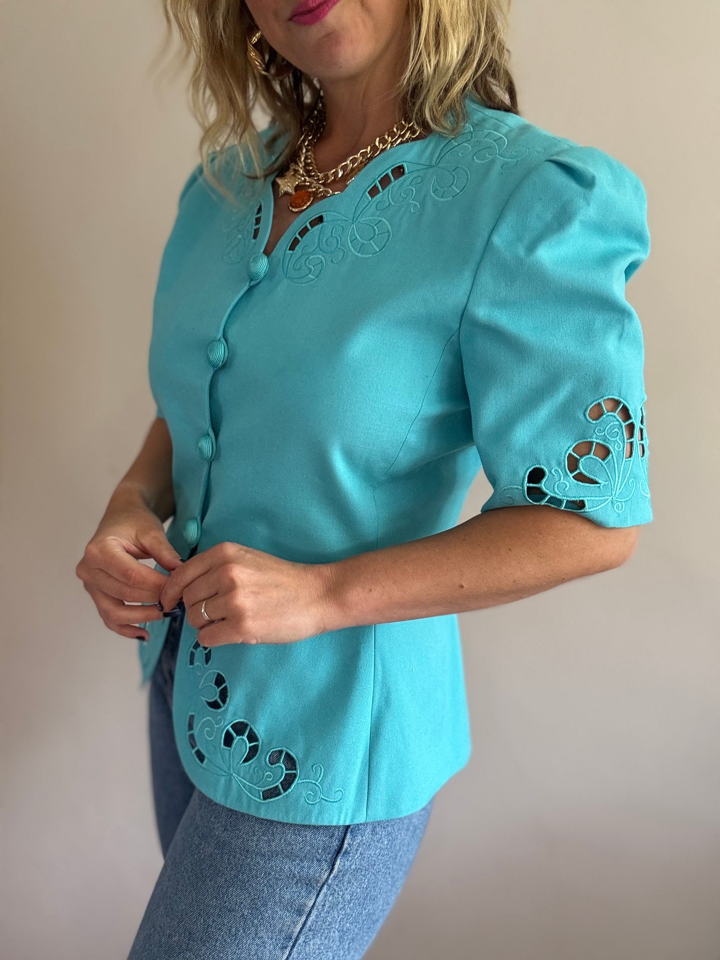 Vintage teal jacket with cut-out details